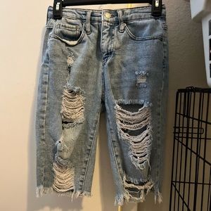 Mid length ripped jeans